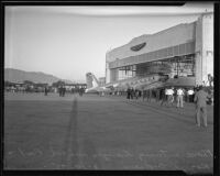 Plane carrying the bodies of Will Rogers and Wiley Post arrives at Union Air Terminal, Burbank, 1935