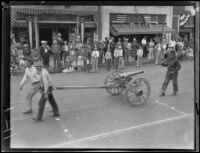 Santa Barbara Fiesta, men with cannon and rifle in parade, Santa Barbara, 1927