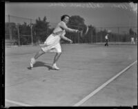 Catherine Rose, Tennis Champion on the Griffith Park tennis team, playing on a court, 1933