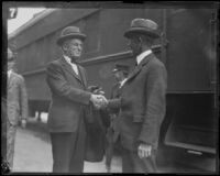 Robert A. Millikan greeted at a train station, Los Angeles, 1920-1939