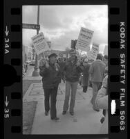 Actors Ed Asner and Dennis Weaver picketing during strike against advertising agencies in Los Angeles, Calif., 1978