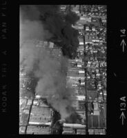 Aerial view of riots following Chicano Moratorium Committee antiwar protest, East Los Angles, 1970