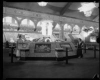 Two women stand in front of the Riverside County display at the Los Angeles County Fair, Pomona, 1933