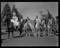 Possible bridal procession on horseback at the parade for the Old Spanish Days Fiesta, Santa Barbara, 1932