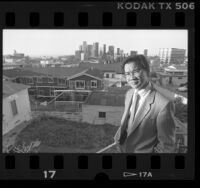 Haing S. Ngor on balcony overlooking downtown Los Angeles, Calif., 1988