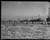 Distant view of bystanders looking on railroad accident, Glendale, 1935