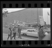 Protesters on Avenue of the Stars during President Johnson's visit to the Century Plaza Hotel. 1967