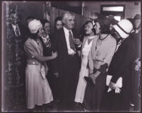 Prosecuting attorney W. Joseph Ford surrounded by young women, Los Angeles, 1931