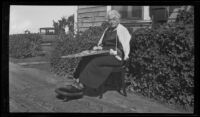 Maria B. Armstrong with a tapestry loom, 1920-1939