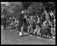 Spectators seated along the route of the Tournament of Roses Parade, Pasadena, 1932