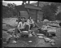 Gold miners Mr. and Mrs. Frank Robison panning for gold, San Gabriel Canyon, 1932