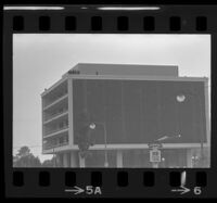 Police atop building near Century Plaza awaiting President Johnson's arrival, 1967