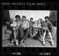 African American foster family, the Whitmores, with their three white foster children in Pasadena, Calif., 1980