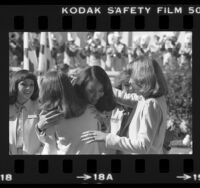 Leslie Kim Kawai hugging another contestant after being named Rose Queen in Pasadena, Calif., 1980