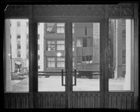 Looking outside from an entrance of the unfinished California State Building in downtown Los Angeles, early 1930s