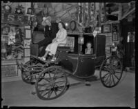 People in a carriage at the Pony Express Museum, Arcadia, 1930s