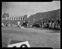 Notre Dame player returns to bench during football game against USC, Los Angeles, 1938