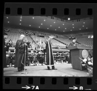 Regent Edward W. Carter, UCLA's Clark Kerr and Britain's Prince Philip on stage during presentation of honorary law degree to Prince Philip in Los Angeles, Calif., 1966