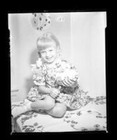 Kathy Soderman empties her piggy bank to contribute to a fund for the remuneration volunteers who attempted to save Kathy Fiscus, 1949