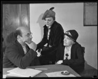 Dave Coleman, district attorney, questioning complaining witnesses Madam Nan Kee and Miss Hilda Parvey for Earl W. Taylor trial, Los Angeles, 1935