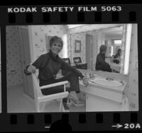 Actress Mary Tyler Moore sitting before dressing table, 1978