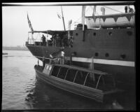 Commander Richard E. Byrd boards the C. A. Larsen from a speed boat, Los Angeles, 1928