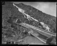 Damaged Los Angeles Aqueduct pipes lie on a hillside in No-Name Canyon, Inyo County vicinity, [about 1927]