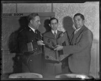 Mexican Consul Ricardo Hill attends as General Saturnino Cedillo presents dueling pistols to Sherriff James E. Davis, Los Angeles, 1935