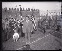 Judge Charles L. Bogue standing in the Coliseum during an Armistice Day celebration, Los Angeles, 1925