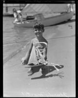 Hardy Martel of Balboa and his sailboat at the Tournament of Lights, Balboa peninsula (Newport Beach), 1935