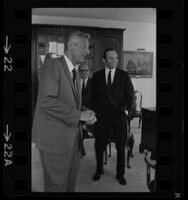 Lew Wasserman (left), Daniel Ritchie (right) and Jules Stein (background), founder of MCA, being interviewed by Arelo Sederburg, 1969