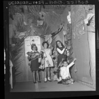 Children putting up harvest decorations in Congregation Shaarei Tefila synagogue in Los Angeles, Calif., 1963