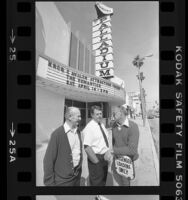 Henry Lyman, George Ullman and Dick White standing under the marquee of the Hollywood Palladium in Hollywood, Calif., 1984