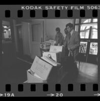 State Senator Alan Robbins and Reverend W. C. Jackson wheeling antibusing initiative petitions into the Los Angeles County Registrar-Recorder's office, 1978