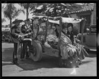 Women riding a cart serenaded by 2 men at the Old Spanish Days Fiesta, Santa Barbara, 1932