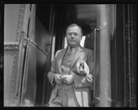 Occidental College president Remsen D. Bird at exit from train, Los Angeles, 1935