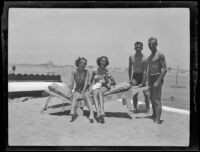 Sisters Kathleen and Renata Titus at the beach with Navy ensigns Walter Combs Jr. and Charles Eisenbach, Newport Beach, 1936