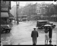 Flooded intersection of 1st St. and Broadway during a rainstorm, Los Angeles, [1926?]