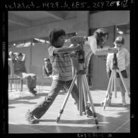 Third-graders learning to operate movie cameras at Barnsdall Park Junior Arts Center, Los Angeles, Calif., 1971