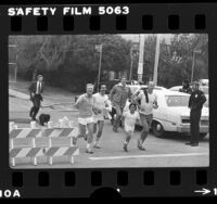 U.S. President Jimmy Carter on morning run with Stephen Rodriguez in El Sereno, Calif., 1979