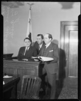 Oil executive James A. Talbot on witness stand with lawyers, 1932