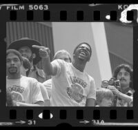 Magic Johnson wearing NBA championship t-shirt at Lakers rally in Los Angeles, Calif., 1980