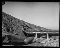 Damaged section of dynamited pipe along the Los Angeles Aqueduct in No-Name Canyon, Inyo County vicinity, [about 1927]