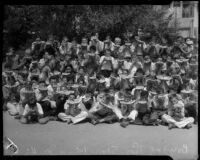 Thomas Starr King Junior High boys eating watermelons, Los Angeles, 1934