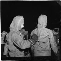 Military personnel put on diving suits during the Army-Navy maneuvers that took place off the coast of Southern California in late 1946