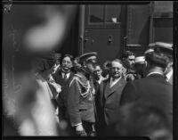 Prince and Princess Kaya of Japan are escorted through a crowd at La Grande Station by Mayor Frank Shaw, Los Angeles, 1934