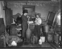 Assistant chief liquor control officer Prentiss Moore leading a raid on the home of Cole Catalonotte, Los Angeles, 1935