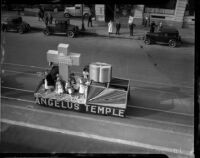 Members of Angelus Temple ride a parade float, Los Angeles, 1935