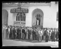 Essie Binkley West and men outside Old Time Faith Sunshine Mission in Los Angeles, Calif., 1949