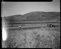 Race car drivers Rex Mays and Bob Swanson compete at the Legion Ascot speedway, Los Angeles, 1935